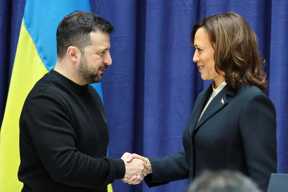 U.S. Vice President Kamala Harris and Ukrainian President Volodymyr Zelenskiy shake hands as they attend a press conference during the Munich Security Conference (MSC) in Munich, Germany February 17, 2024. REUTERS/Wolfgang Rattay/Pool/ File Photo