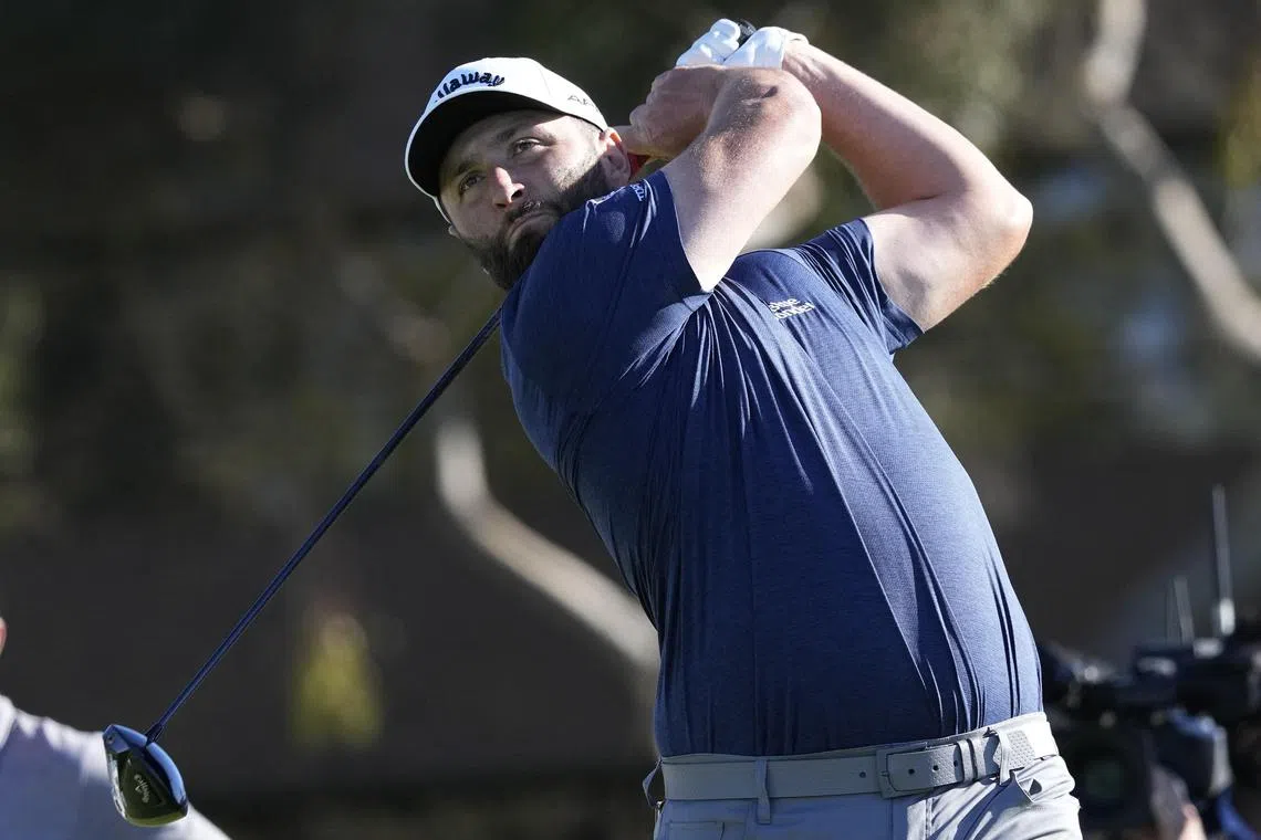 Jon Rahm hits his tee shot on the 14th hole during the third round of the Farmers Insurance Open golf tournament on Jan 27.