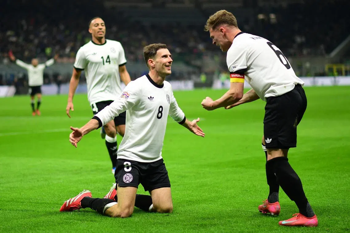 Germany's Leon Goretzka celebrates scoring their second goal with Joshua Kimmich.