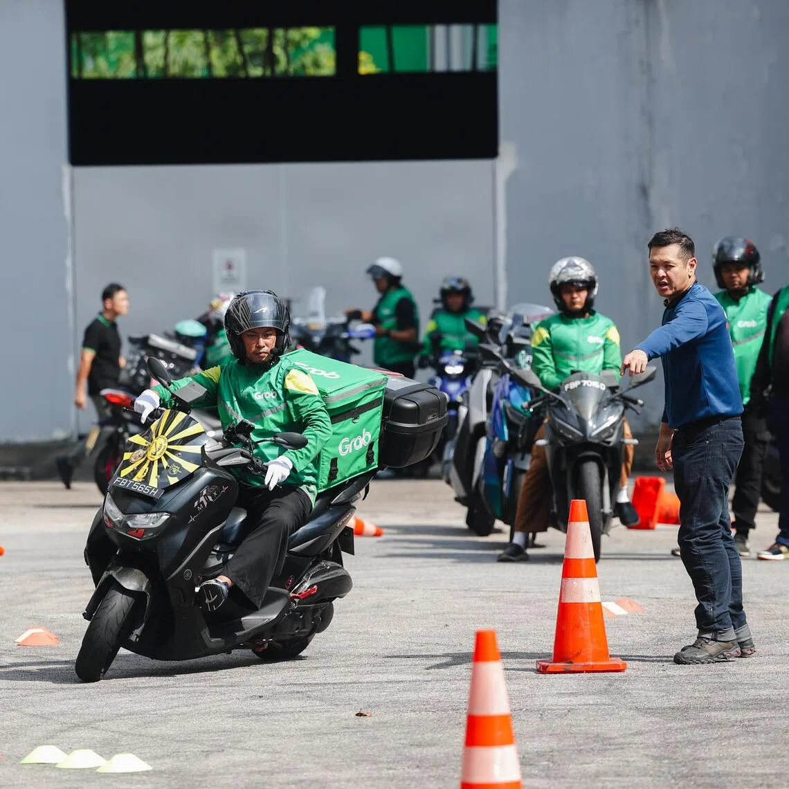 Grab has launched a safety riding programme for delivery workers to learn how to manoeuvre their motorcycles with loaded bags and in tight spaces, among other skills.