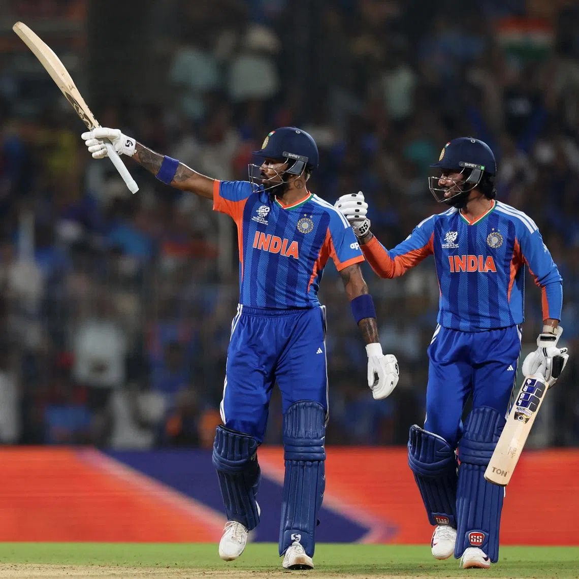 Cricket - ICC Men's T20 World Cup 2026 - Super 8 - India v Zimbabwe - MA Chidambaram Stadium, Chennai, India - February 26, 2026 India's Hardik Pandya celebrates with Tilak Varma after reaching his half century REUTERS/Priyanshu Singh