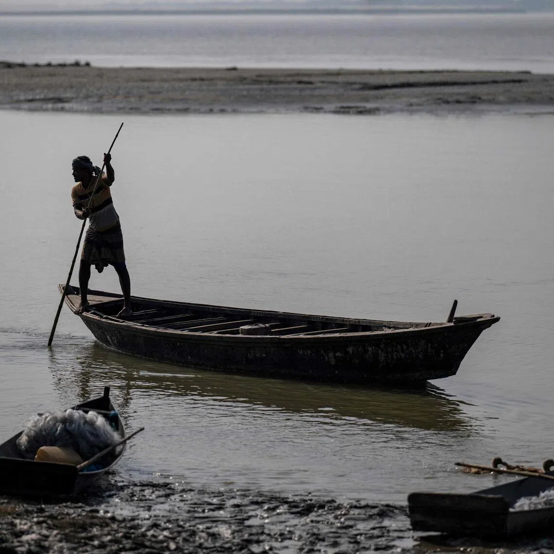 A man ferrying a boat along the Padma river at Ramnathpur village, near the Bangladesh-India frontier in Bangladesh’s Rajshahi division, on Oct 13.