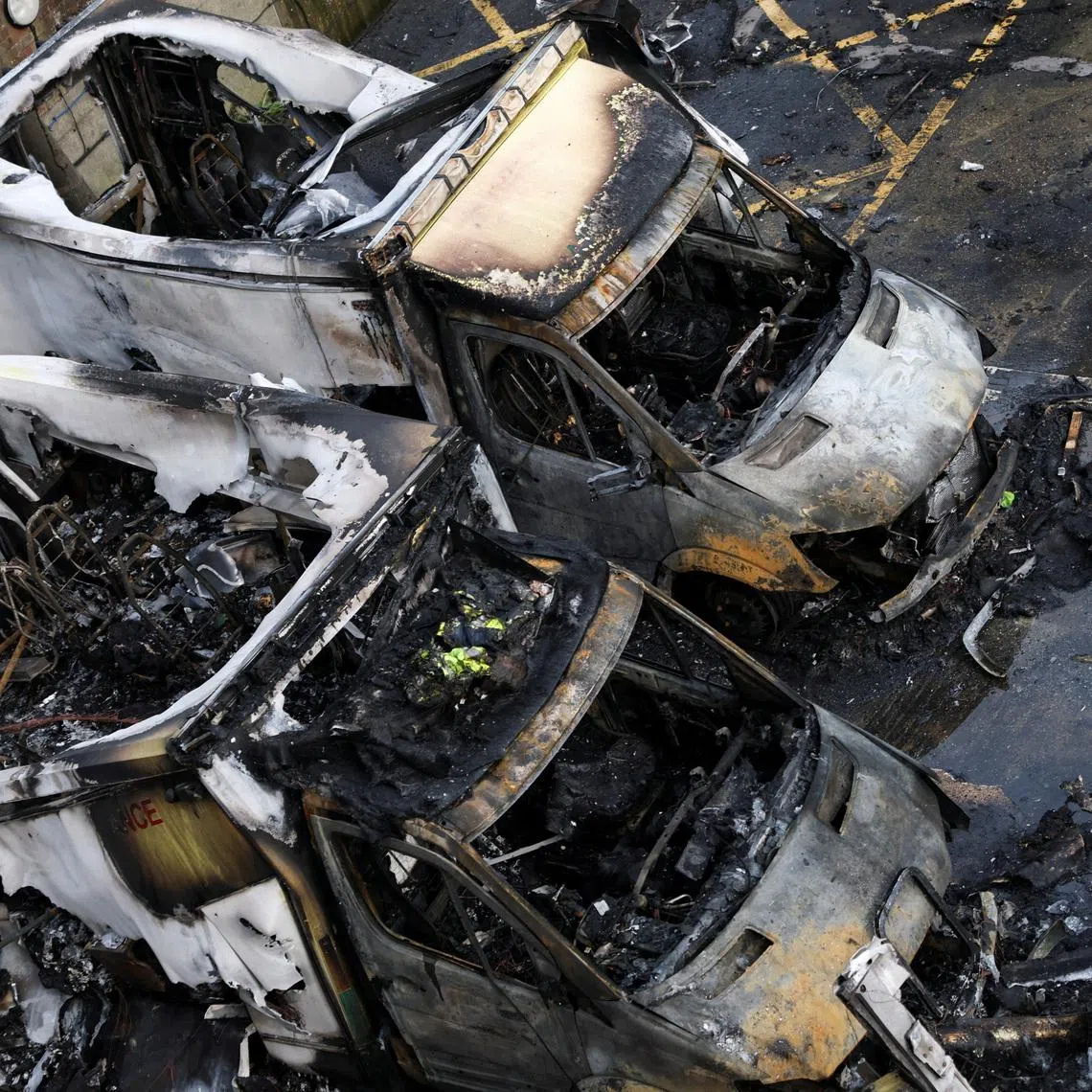 Charred remains of ambulances belonging to Hatzola, a Jewish community organisation, which were set on fire in an incident that the police say is being treated as an antisemitic hate crime, in northwest London, Britain, March 23, 2026. REUTERS/Hannah McKay
