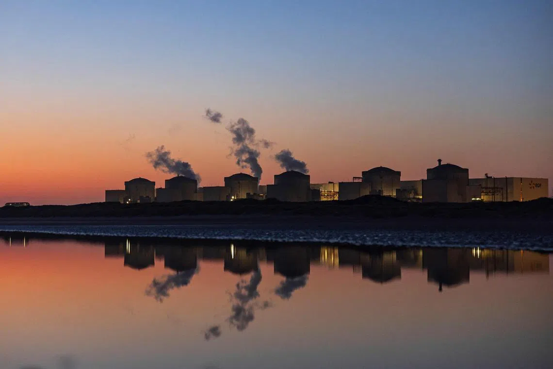 The Gravelines nuclear power plant during sunrise in Gravelines, northern France on Aug 11. Four units at the  plant were shut down due to the "massive and unforeseeable presence of jellyfish" in the pumping stations.  