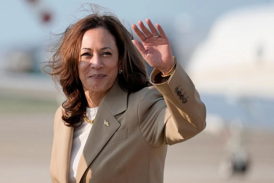 U.S. Vice President Kamala Harris waves upon arrival at Joint Base Andrews in Maryland,  July 27, 2024.  Stephanie Scarbrough/Pool via REUTERS