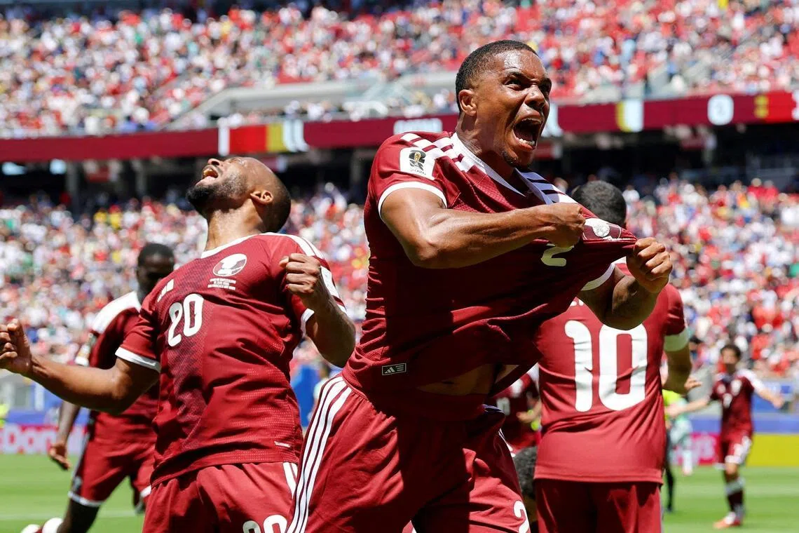 Qatar's Pedro Miguel celebrating after Boualem Khoukhi scored the equaliser against Switzerland four minutes into injury time.