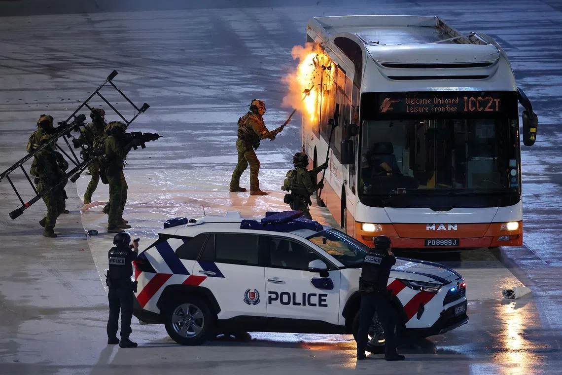 The SAF's Special Operations Task Force simulating the storming of a hijacked bus during the Total Defence Display on Aug 9.