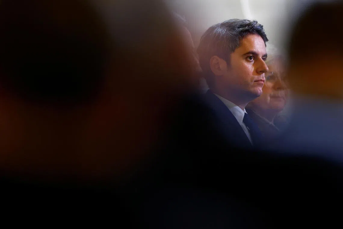 French Prime Minister Gabriel Attal attends President Emmanuel Macron's (not pictured) press conference to answer questions from journalists after naming a new government, at the Elysee Palace in Paris, France, January 16, 2024. REUTERS/Christian Hartmann