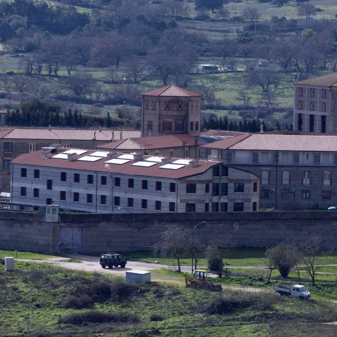 Vehicles stand near the Badu'e Carros prison in Nuoro, Italy, February 1, 2026. REUTERS/Remo Casilli