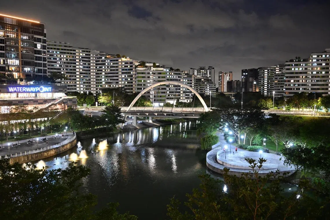 Aerial view of HDB flats near Waterway Point shopping mall and Watertown condominium along My Waterfront @ Punggol, 4 January 2023. waterfront living, property, electricity, energy, PUB ABC (active beautiful canal projects).