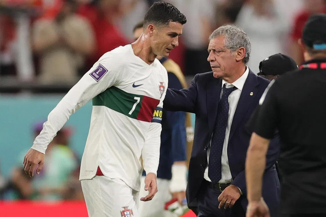 Coach Fernando Santos (right), as a tearful Ronaldo leaves the pitch after Portugal's loss.