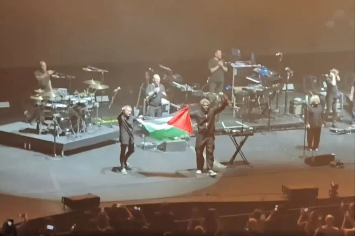 Two band members were seen holding a Palestinian flag on stage during Massive Attack’s concert on July 29.