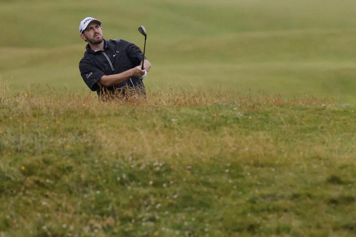 Patrick Cantlay of the US chips onto the 15th green during the third round of the British Open.