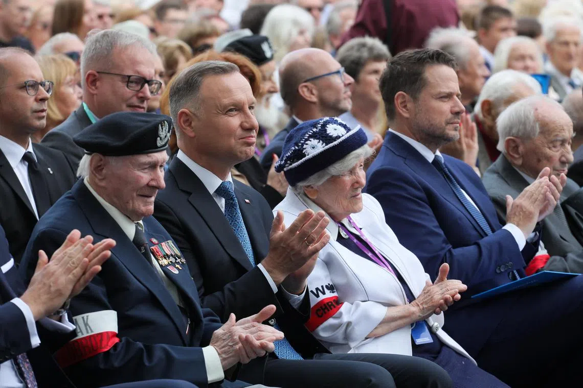 epa10776839 In the front row: President of the Republic of Poland Andrzej Duda (2-L), President of Warsaw Rafal Trzaskowski (2-R) and Vice President of the Board of the Union of Warsaw Insurgents Leszek Mindziukiewicz (R) during a meeting of state officials with participants in the Warsaw Uprising, on the grounds of the Warsaw Uprising Museum in Warsaw, Poland, 30 July 2023. The commemoration of the 79th anniversary of the outbreak of the Warsaw Uprising is underway.  EPA-EFE/Pawel Supernak POLAND OUT