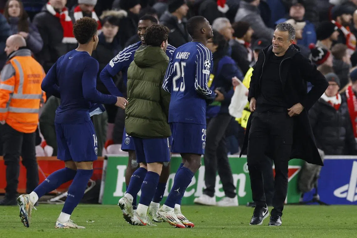 Soccer Football - Champions League - Round of 16 - Second Leg - Liverpool v Paris St Germain - Anfield, Liverpool, Britain - March 11, 2025 Paris St Germain's Nuno Mendes and coach Luis Enrique celebrate after the match Action Images via Reuters/Jason Cairnduff