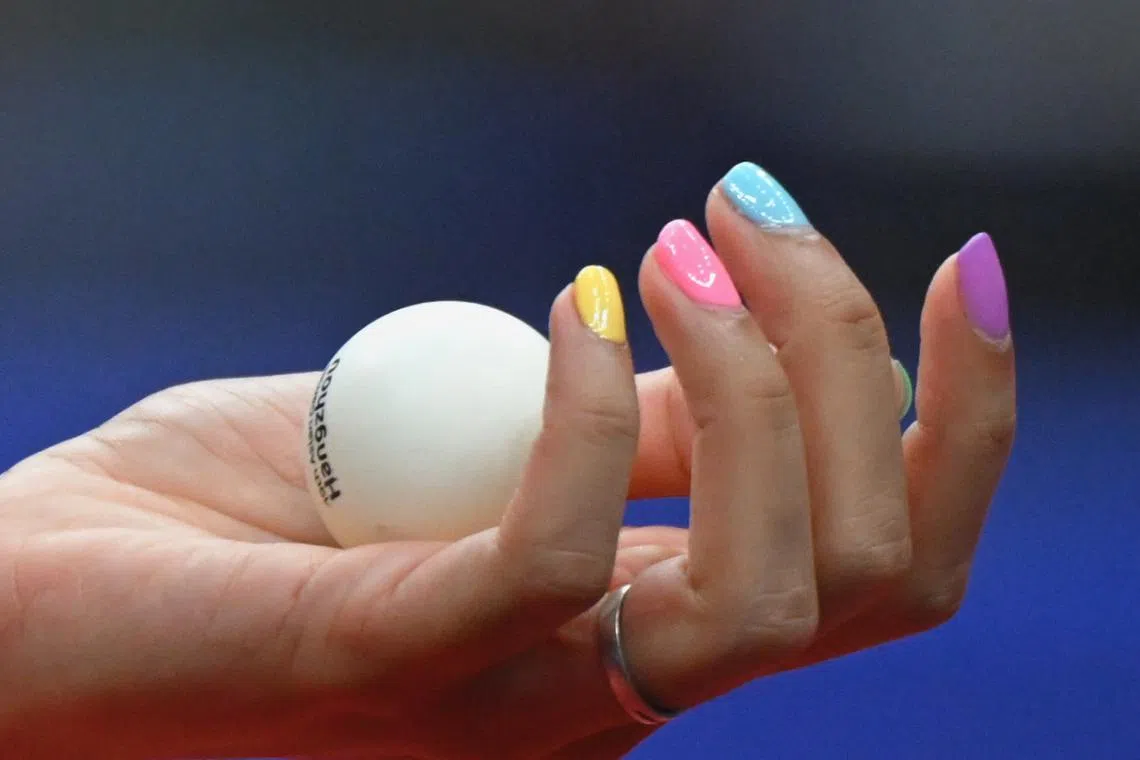 Indian table tennis player Manika Batra sporting colourful nails during her women's team Group F match against Singapore's Zhou Jingyi at the Gongshu Canal Sports Gymnasium on Sept 22.