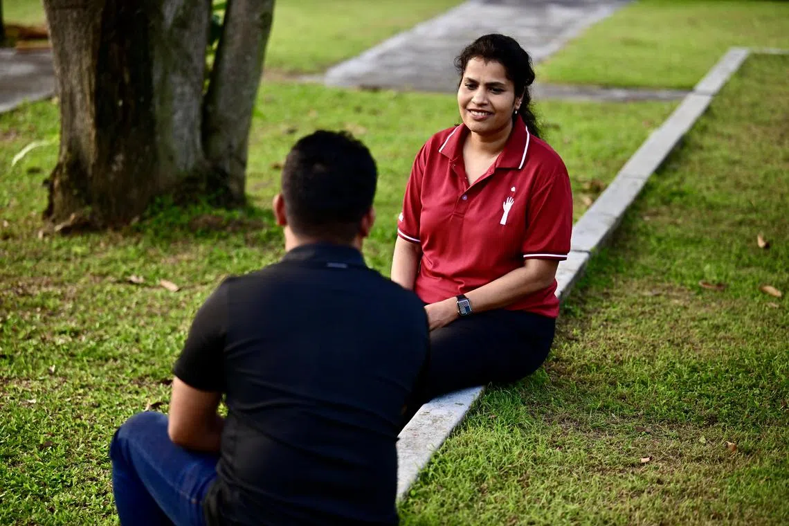 Ms Durga Arivan (right), senior psychotherapist and manager of psychotherapy and counselling services at local charity HealthServe, guides migrant workers through their trauma and grief after workplace accidents.