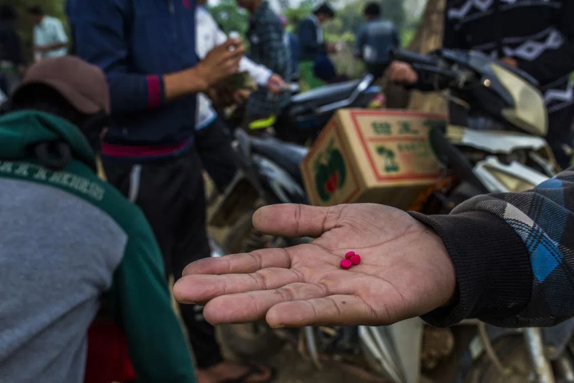 A yaba dealer selling pills in Lashio, in Myanmar's northern Shan state in 2019. Shan state is known as the leading source of synthetic drugs in the region.