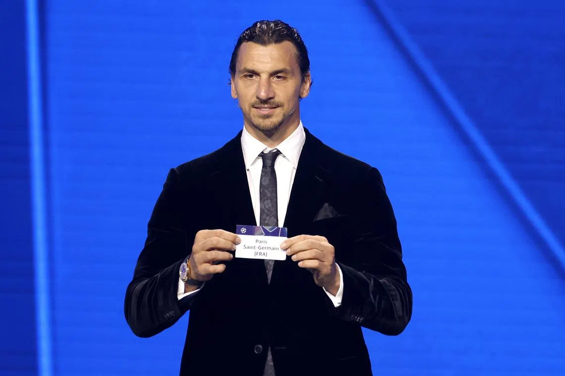 Former Swedish international Zlatan Ibrahimovic showing the PSG ticket on Aug 28, during the draw for the league phase of the Champions League tournament.