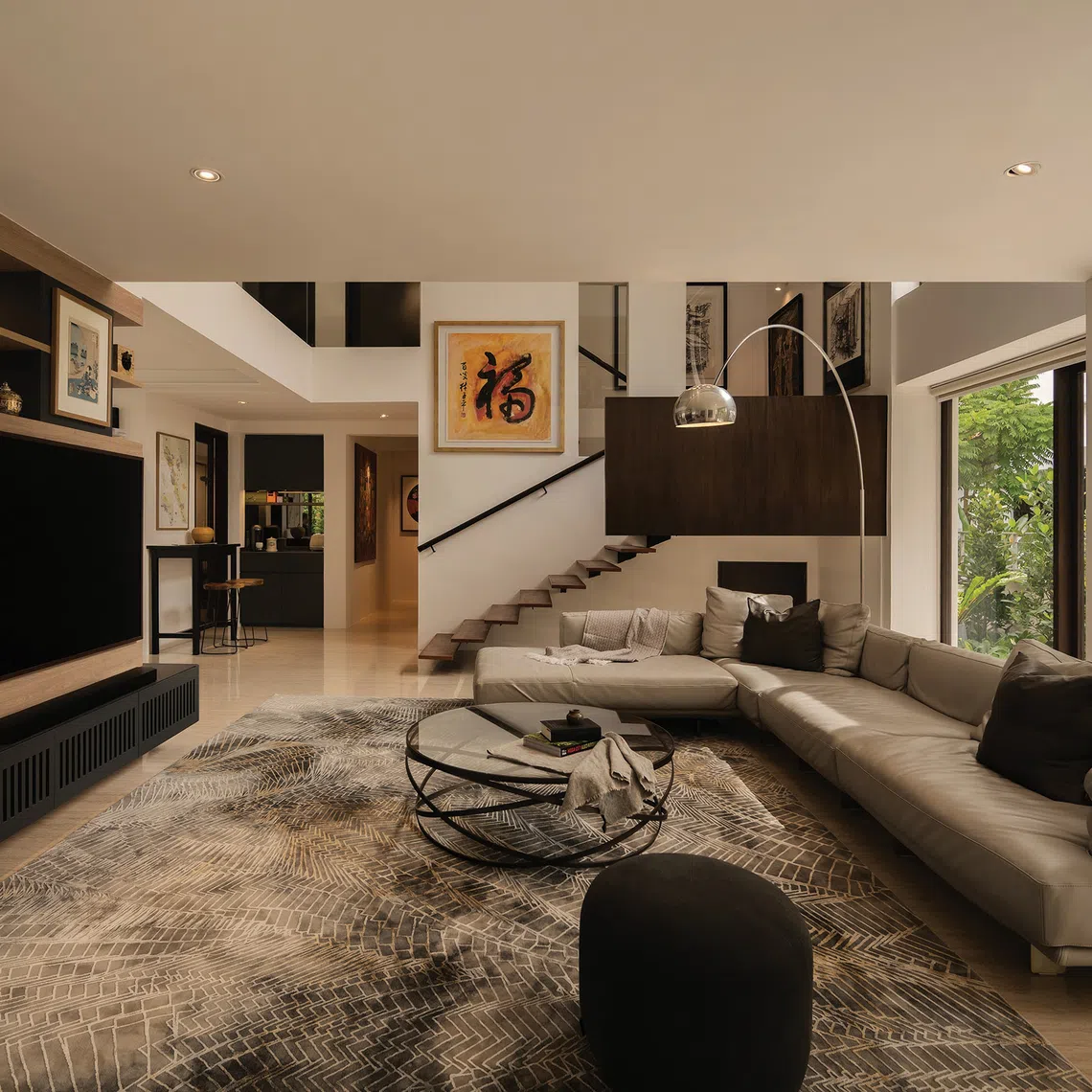 A display cabinet on the ground floor of this detached house acts as a divider between the living and dining areas.