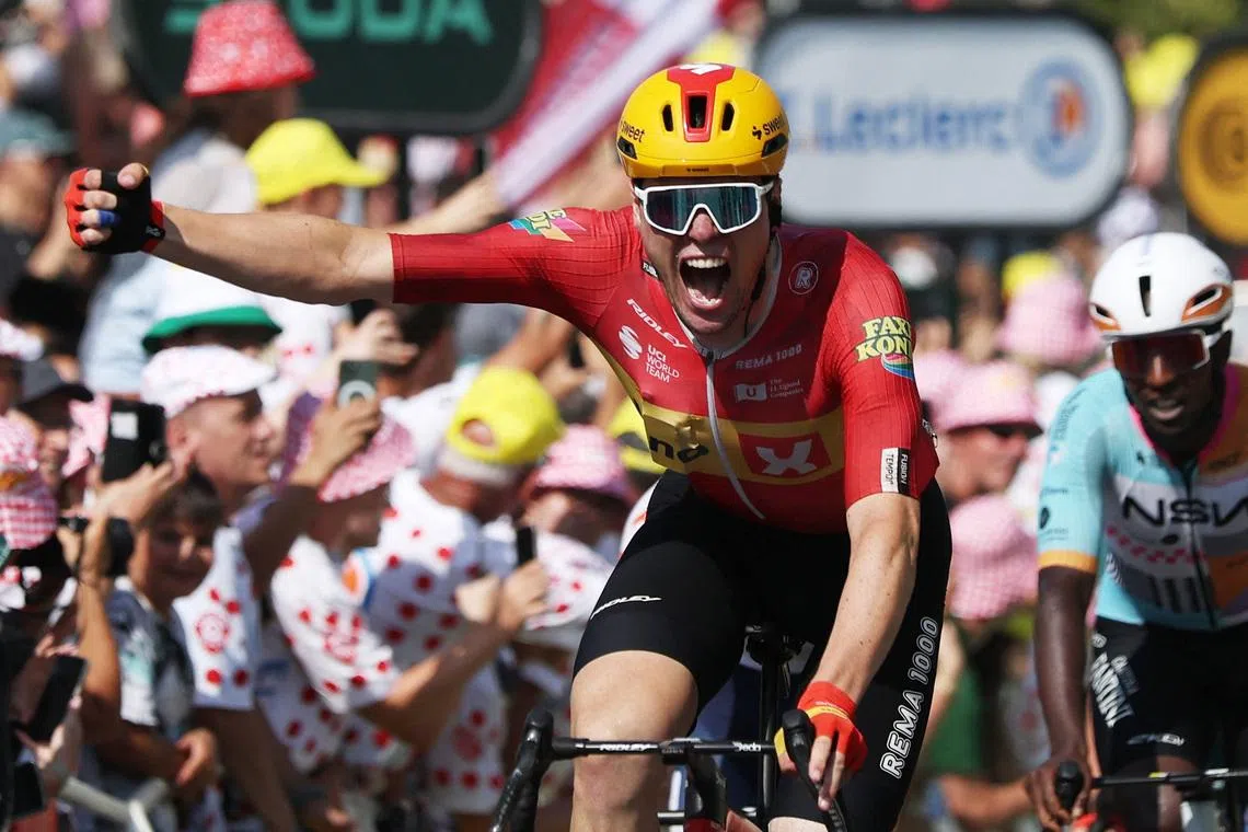 Uno-X Mobility’s Soren Waerenskjold celebrates winning stage 11 of the Tour de France on July 15.