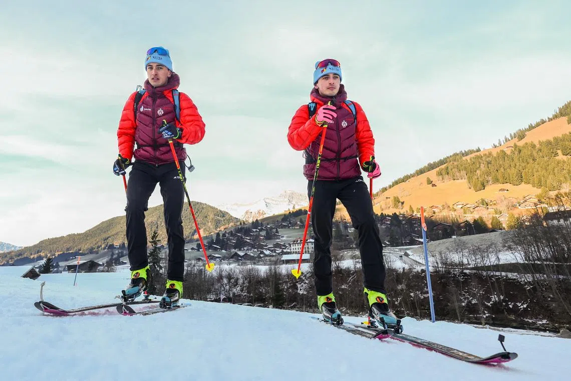 Twin brothers Robin and Thomas Bussard pose after a ski mountaineering training session as they aim to qualify for the 2026 Milano-Cortina Winter Olympics in Bormio, in Rougemont, Switzerland, December 18, 2025. REUTERS/Denis Balibouse
