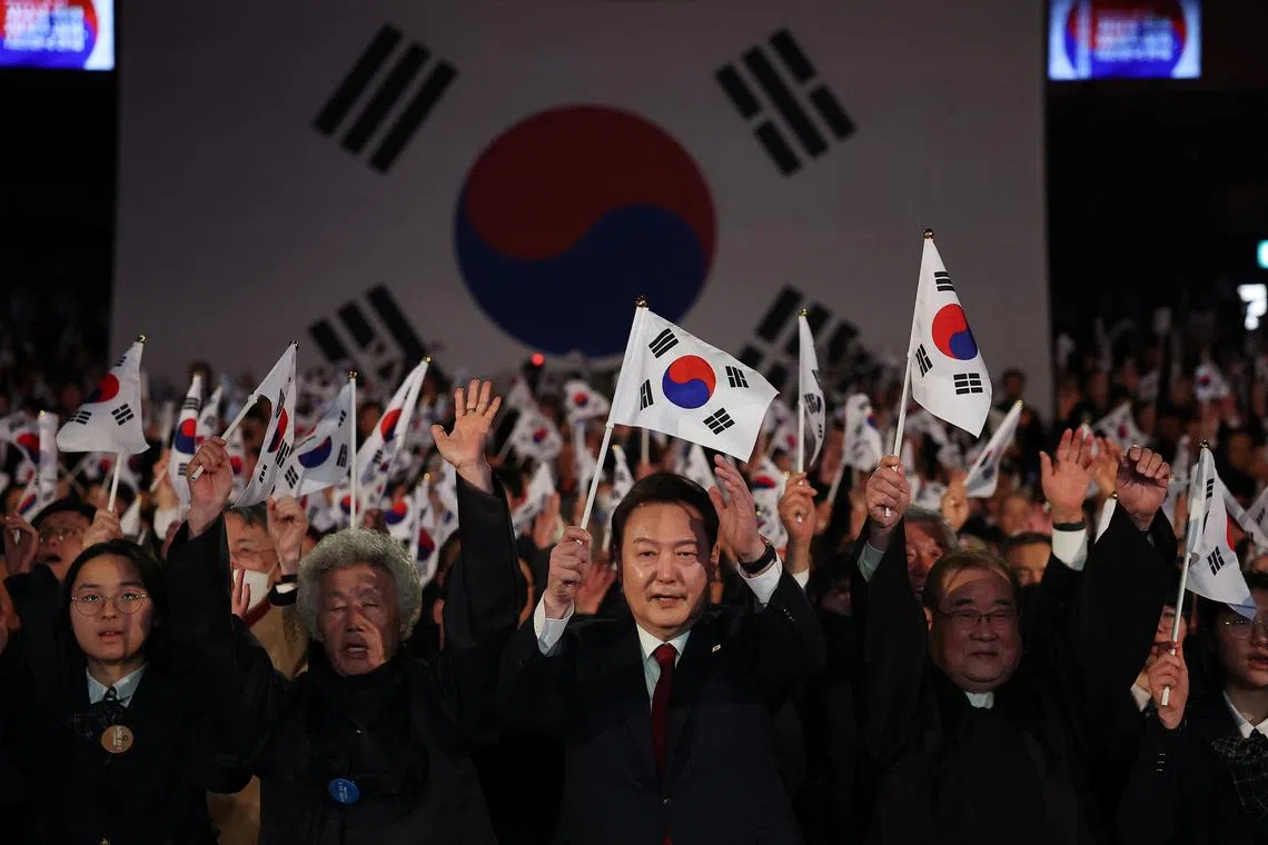 South Korea's President Yoon Suk Yeol gives three cheers during a ceremony of the 105th anniversary of the March 1st Independence Movement Day in Seoul, South Korea, March 1, 2024.    REUTERS/Kim Hong-Ji/Pool/File Photo