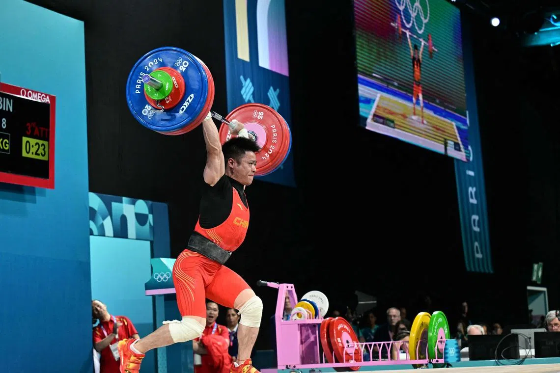 China's Li Fabin in the men's 61kg weightlifting event at the Paris Olympic Games on Aug 7, 2024.
