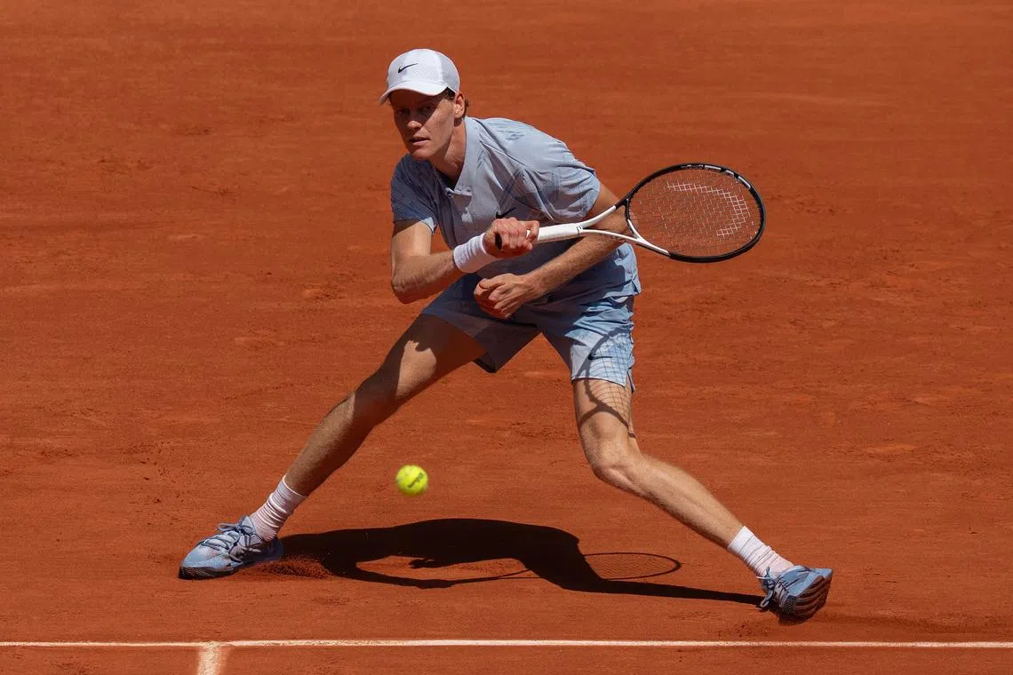 May 28, 2026; Paris, France; Jannik Sinner of Italy returns a shot during his match against Juan Manuel Cerundolo of Argentina on day five at Stade Roland Garros. Mandatory Credit: Susan Mullane-Imagn Images
