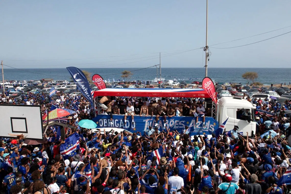 Thousands of ecstatic fans escorted Cape Verde’s Blue Sharks through the streets of Praia on July 5.