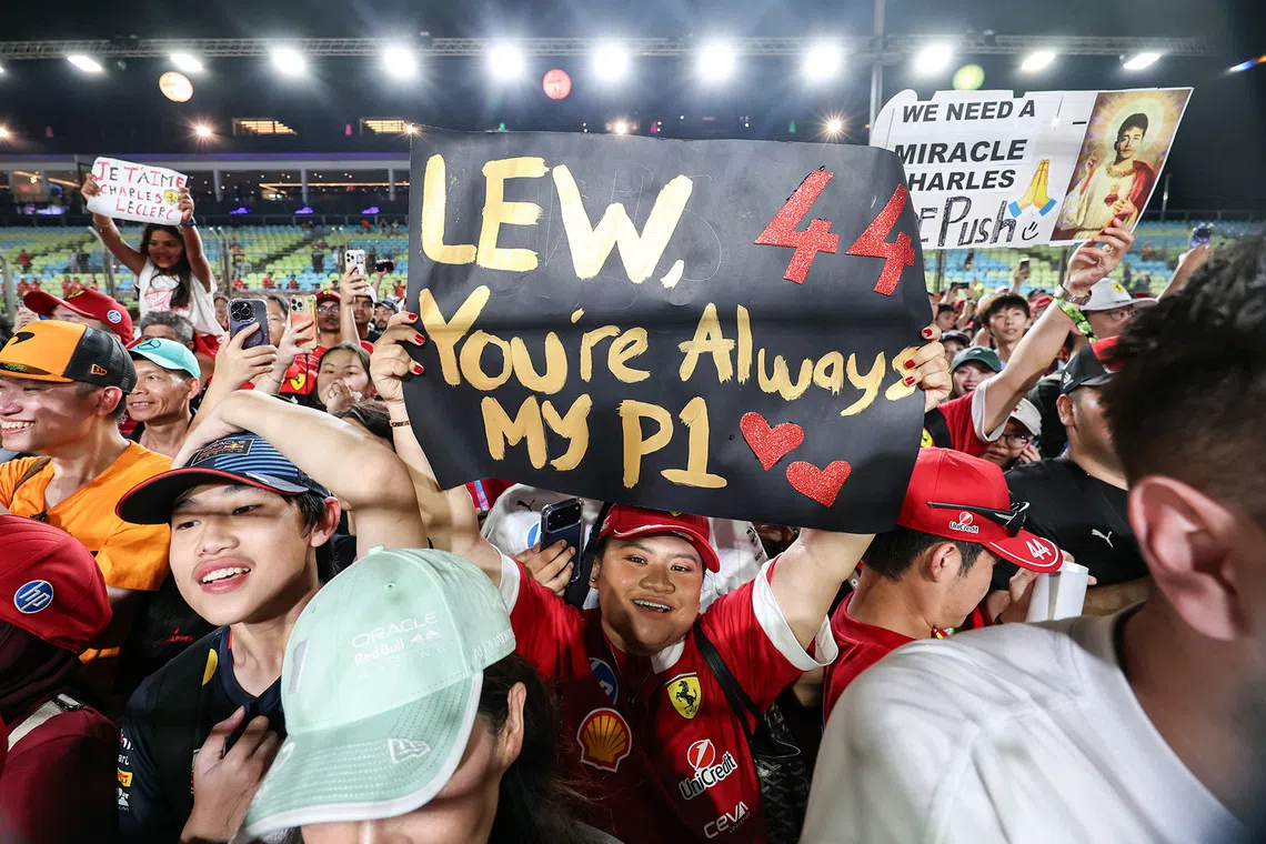 Ferrari fans gathers on the track after the 2025 Formula One Singapore Airlines Singapore Grand Prix at the Marina Bay Street Circuit on Oct 5, 2025. 