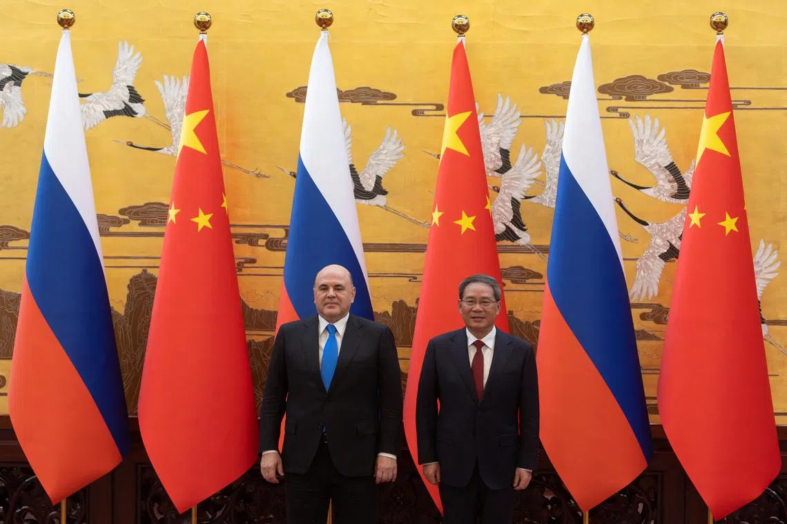 Russian PM Mikhail Mishustin (left) and Chinese Premier Li Qiang signed several agreements involving trade, agriculture and sport, among others. 