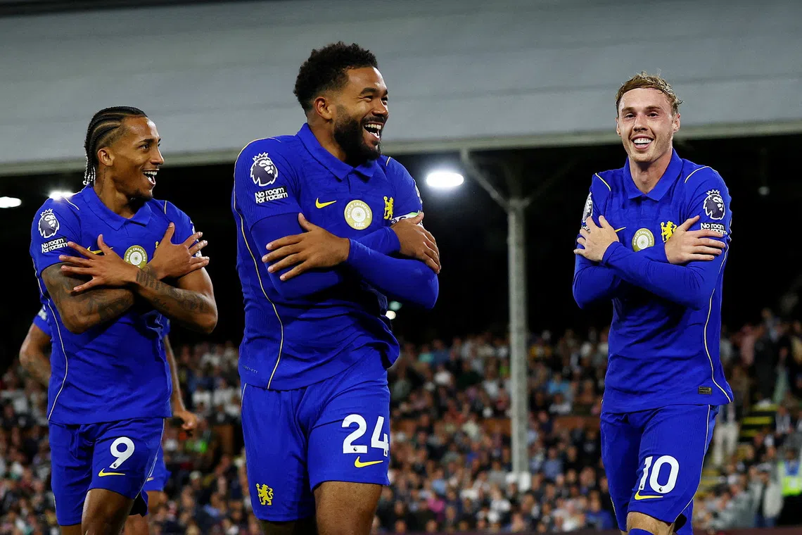 Chelsea’s Cole Palmer (right) celebrates scoring their third goal against Fulham with Joao Pedro and Reece James.