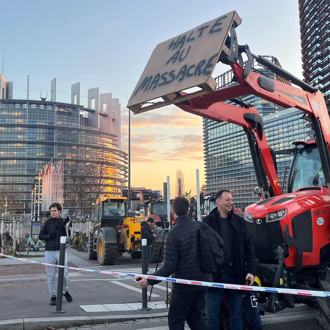 French farmers with their tractors protest in front of the European Parliament against government measures, including the culling of entire cattle herds, aimed at containing an outbreak of lumpy skin disease among livestock in France, and the EU-Mercosur free trade agreement, in Strasbourg, France, December 17, 2025. The slogan reads \"Stop the massacre\". REUTERS/Layli Foroudi
