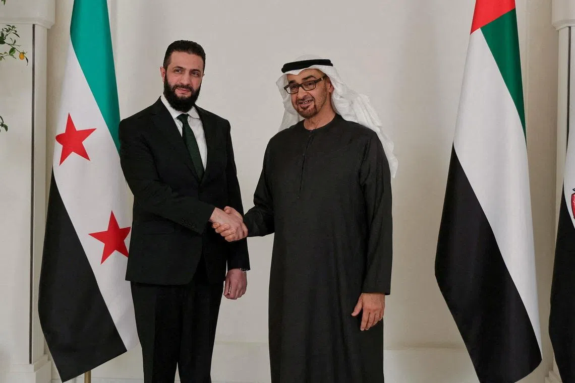FILE PHOTO: Syrian President Ahmed al-Sharaa shakes hands with UAE's President Sheikh Mohamed bin Zayed Al Nahyan, in Abu Dhabi, United Arab Emirates, April 13, 2025. Syrian Presidency/Handout via REUTERS    THIS IMAGE HAS BEEN SUPPLIED BY A THIRD PARTY/File Photo