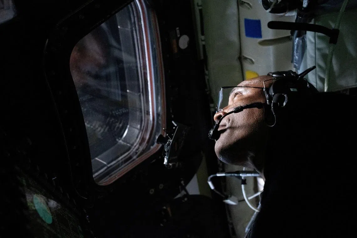 FILE PHOTO: NASA astronaut and Artemis II Pilot Victor Glover is pictured here in the Orion spacecraft during the Artemis II lunar flyby April 6, 2026. NASA/Handout via REUTERS