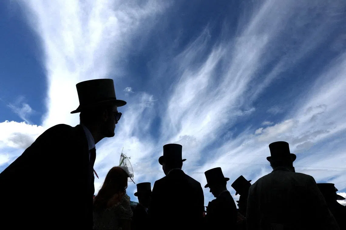Racegoers silhouetted during the Royal Ascot 2026 horse racing festival, held at the Ascot Racecourse, Britain, on June 16, 2026.