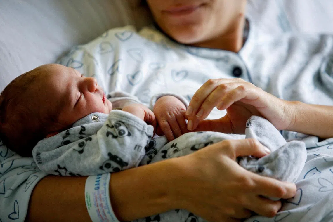 FILE PHOTO: Newborn baby Leonardo rests on his mum Viviana Valente's arms, inside a room of the Santo Spirito Hospital in Rome, Italy, November 14, 2022. REUTERS/Remo Casilli/File Photo