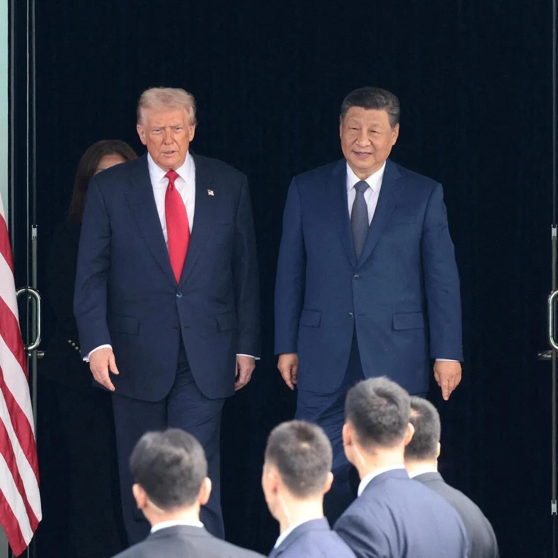 FILE PHOTO: U.S. President Donald Trump and Chinese President Xi Jinping walk as they leave after a bilateral meeting at Gimhae International Airport, on the sidelines of the Asia-Pacific Economic Cooperation (APEC) summit, in Busan, South Korea, October 30, 2025. REUTERS/Evelyn Hockstein/File Photo