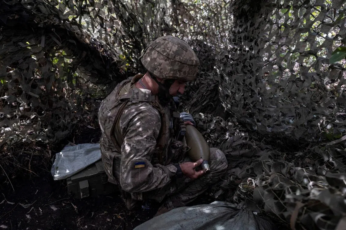 FILE PHOTO: A service member of the 93rd Kholodnyi Yar Separate Mechanized Brigade of the Ukrainian Armed Forces prepares mortar shells before firing toward Russian troops near the frontline town of Kostiantynivka, amid Russia's attack on Ukraine, in Donetsk region, Ukraine, August 26, 2025. Iryna Rybakova/Press Service of the 93rd Kholodnyi Yar Separate Mechanized Brigade of the Ukrainian Armed Forces/Handout via REUTERS/File Photo
