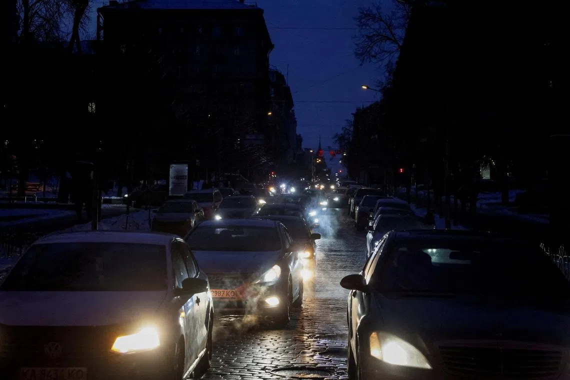 FILE PHOTO: Cars move on a dark street during a power blackout after critical civil infrastructure was hit by recent Russian missile and drone strikes, amid Russia's attack on Ukraine, in Kyiv, Ukraine January 25, 2026. REUTERS/Gleb Garanich/File Photo