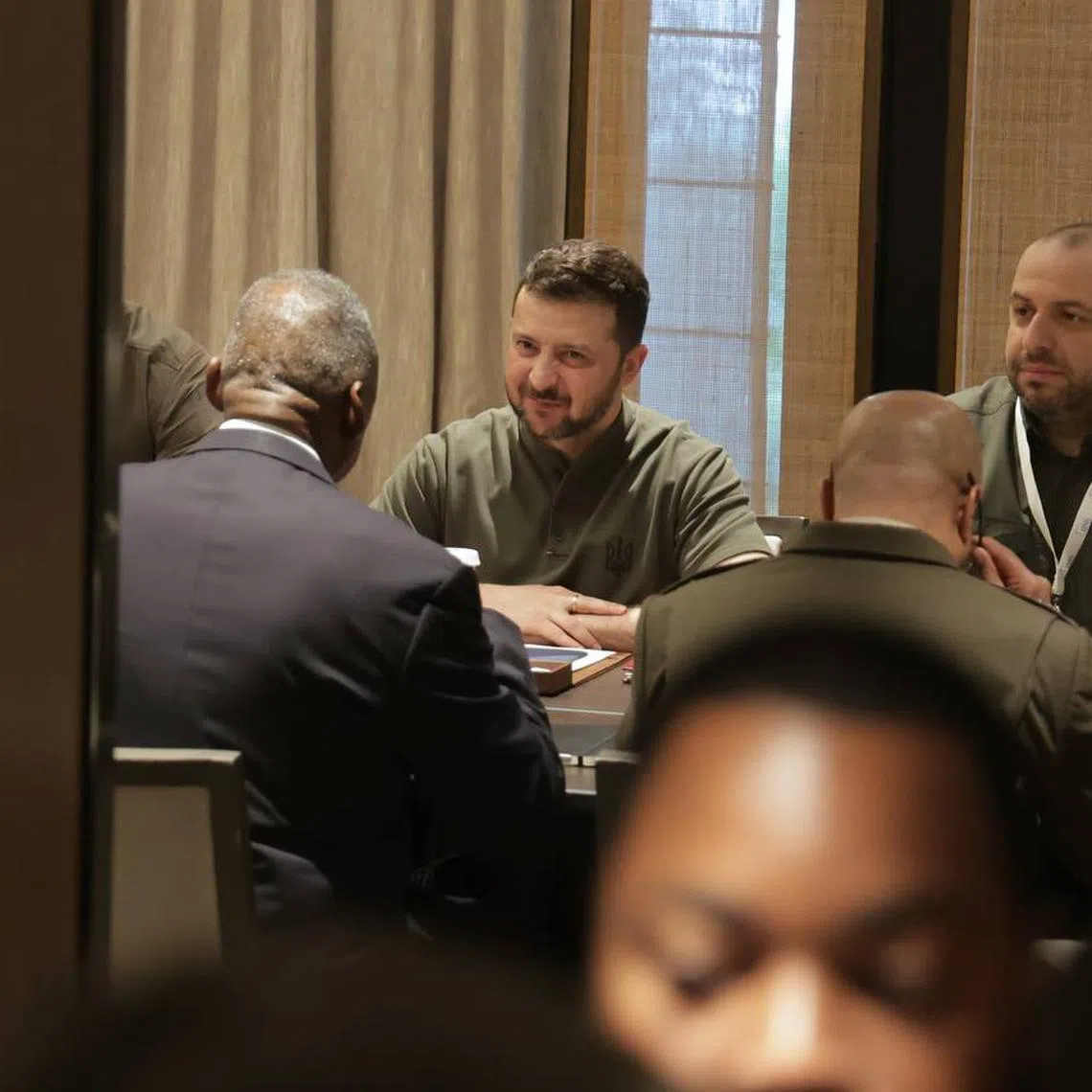 Ukrainian President Volodymyr Zelensky (centre) meeting US Secretary of Defense Lloyd James Austin III (sat opposite) at the Shangri-La Dialogue on June 2.