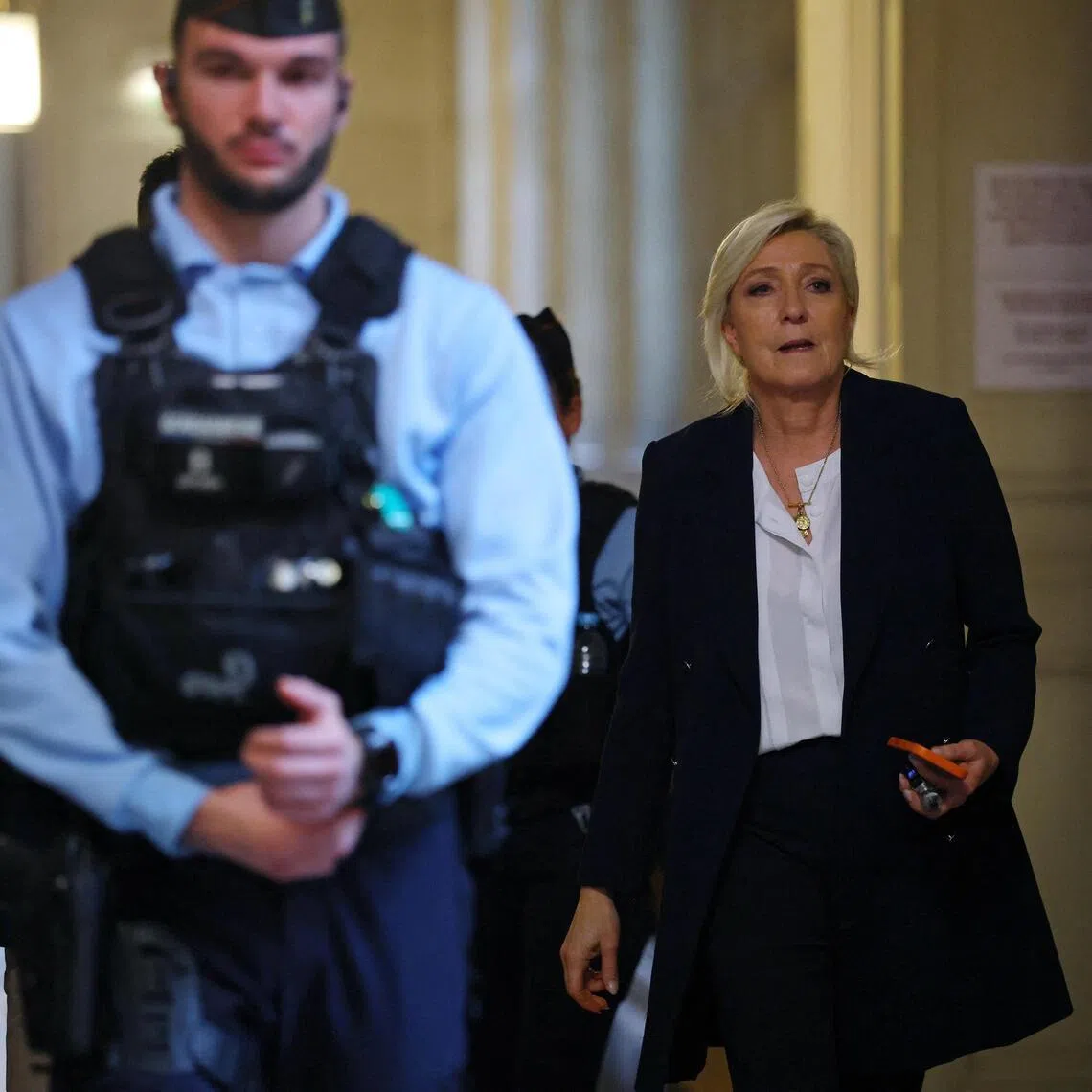 French far-right leader Marine Le Pen returning from a break in her appeal hearing in Paris on Feb 11.