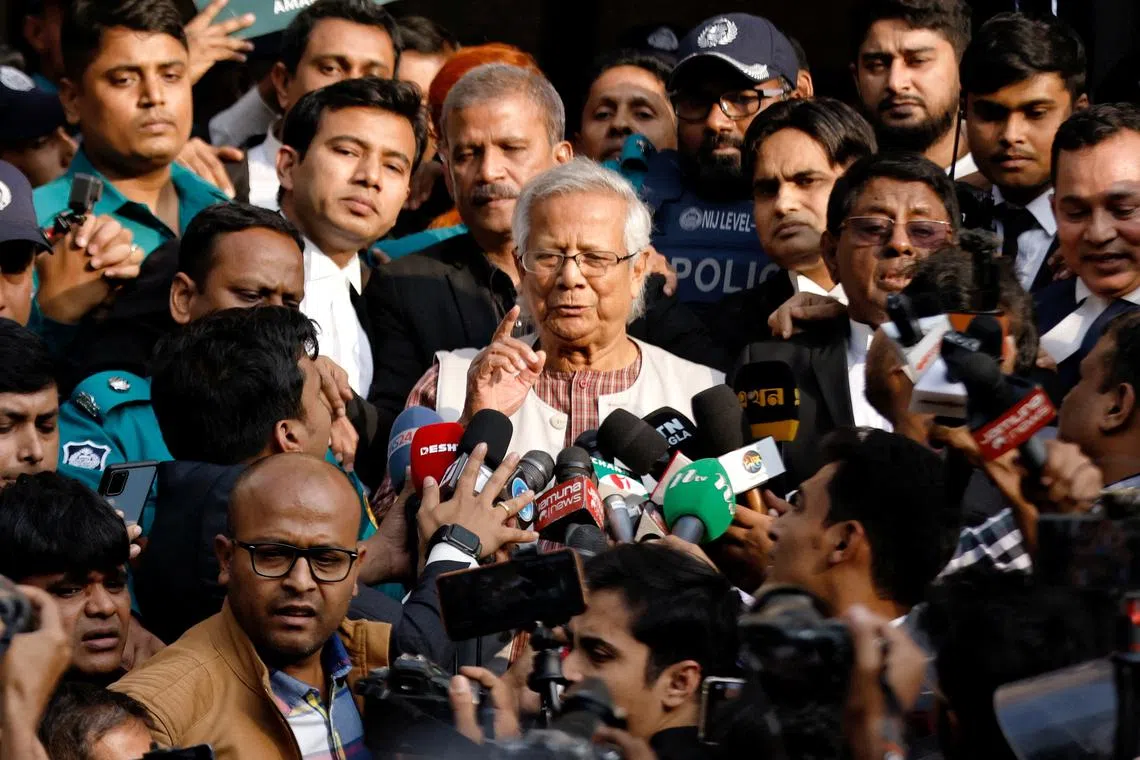 A Dhaka labour court has sentenced Muhammad Yunus (centre), winner of the 2006 Nobel Peace Prize, to six months in jail for alleged wrongdoing at Grameen Telecom.