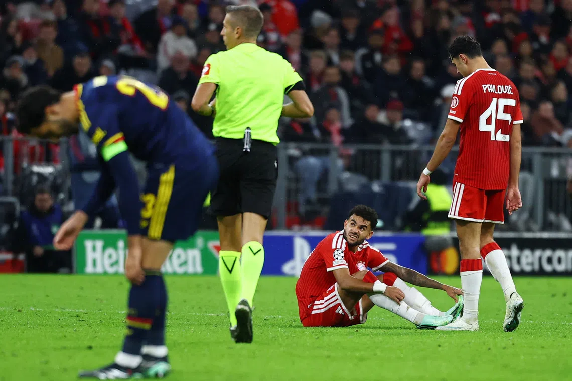 Soccer Football - UEFA Champions League - Bayern Munich v Arsenal - Allianz Arena, Munich, Germany - October 21, 2026  Bayern Munich's Luis Diaz down injured REUTERS/Kai Pfaffenbach