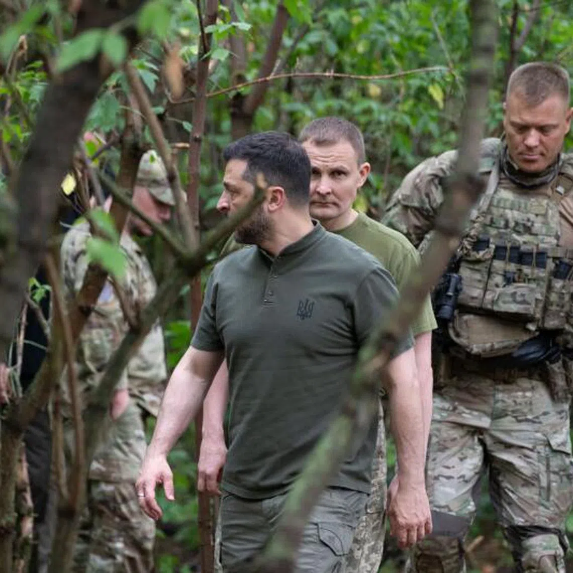 Ukraine's President Volodymyr Zelensky (centre) visiting the frontline positions at an undisclosed location in the Kharkiv region.