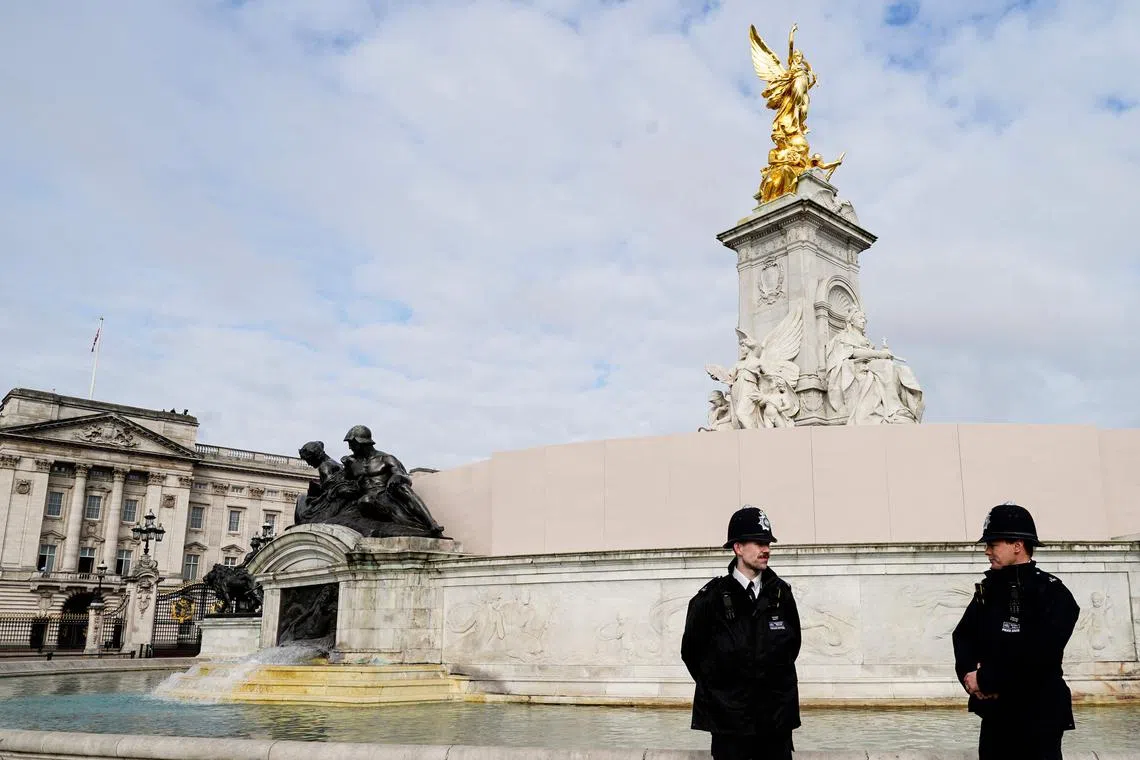 Police officers stand guard in London on May 5.