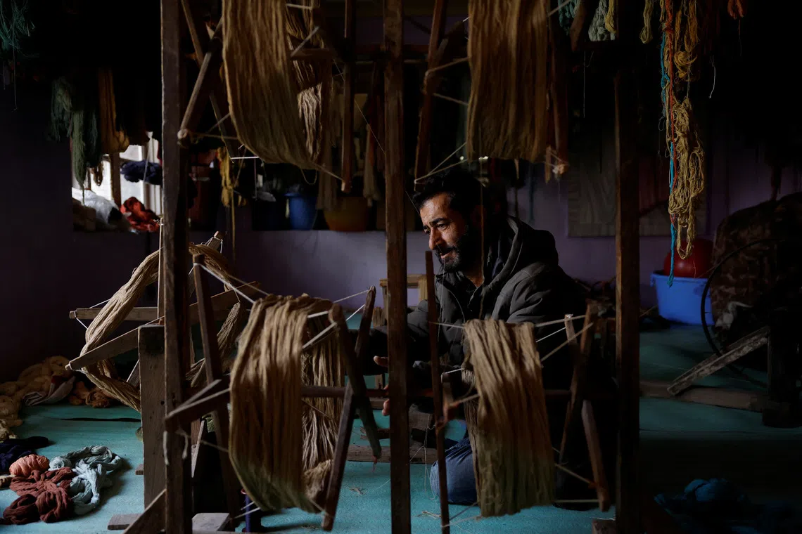 Former carpet weaver Gulzar Ahmad Bhat abandoned his craft of 35 years and now sells tea on the shores of Dal Lake.