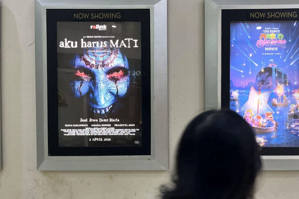 The posters feature the phrases "I Must Die" and "Sell My Soul for Wealth" against the backdrop of a blue, red-eyed creature.