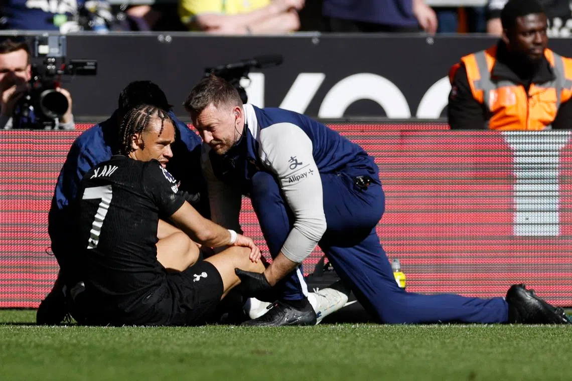 Soccer Football - Premier League - Wolverhampton Wanderers v Tottenham Hotspur - Molineux Stadium, Wolverhampton, Britain - April 25, 2026 Tottenham Hotspur's Xavi Simons receives medical attention after sustaining an injury Action Images via Reuters/Jason Cairnduff